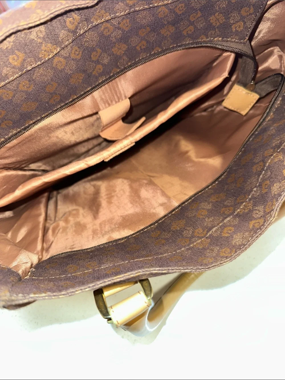 This is a brown Pierre Cardin monogram logo tote bag with beige leather handles.